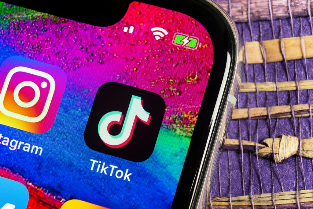 Tik Tok application icon on Apple iPhone X screen close-up. Tik Tok icon. tik tok application. Tiktok Social media network. Social media icon
