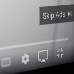 New york, USA - september 19, 2022: Skiping ads in youtube video on screen macro close up view background