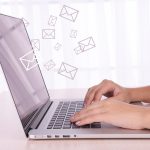 Email concept with laptop and hands